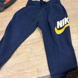 Nike Kids Blue Joggers with Yellow Logo